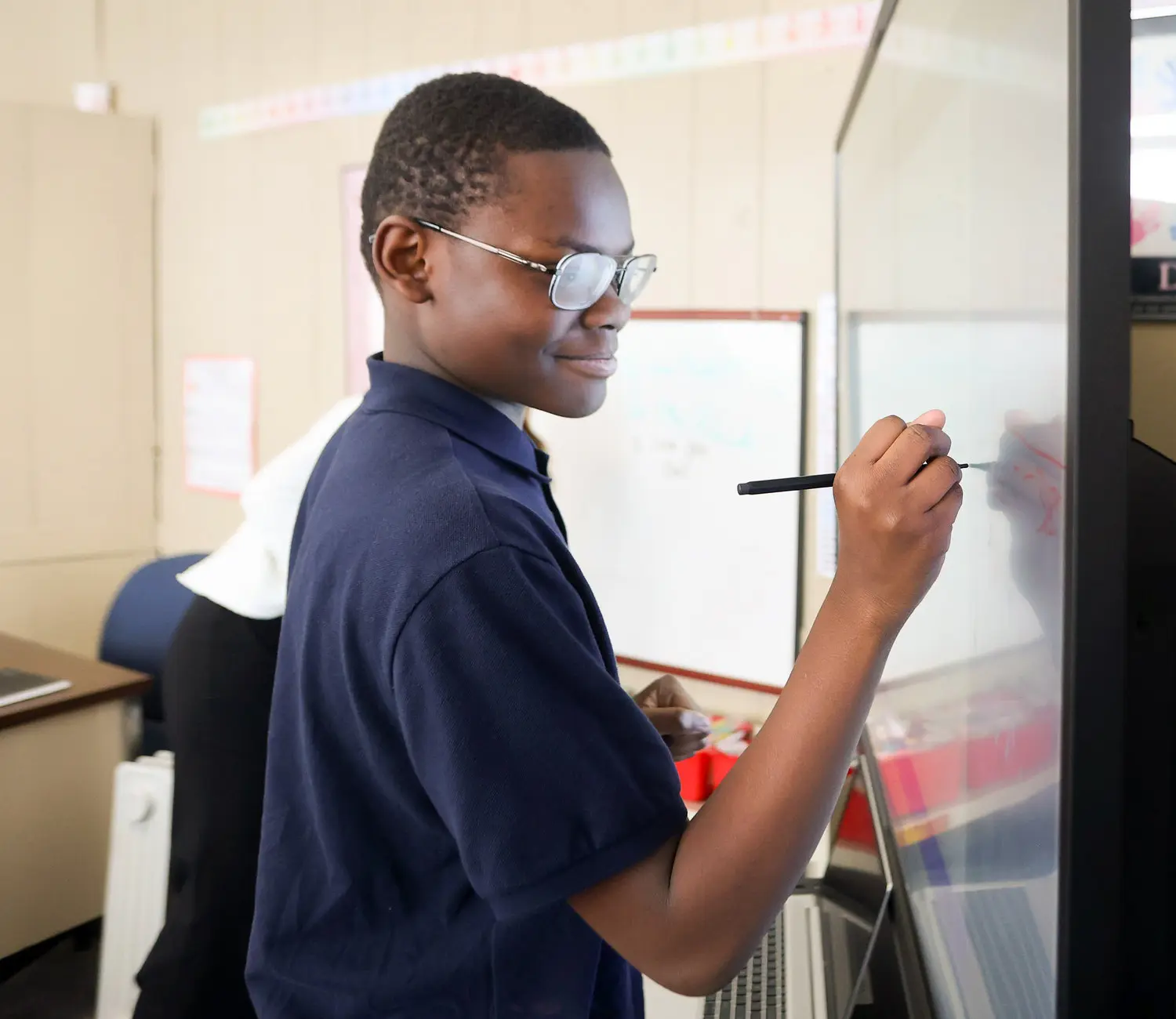 Male student using smart board