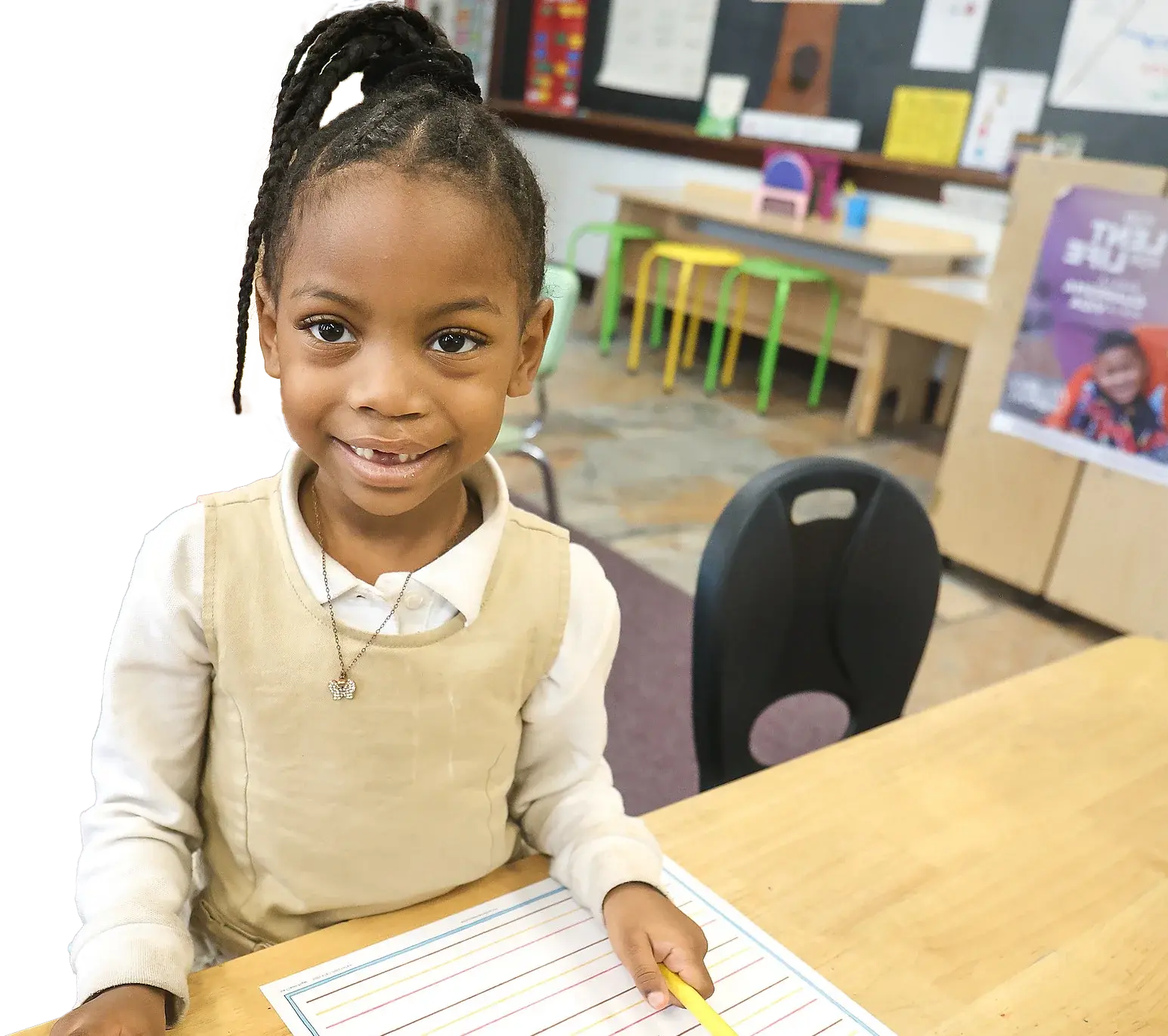 Female elementary school writing on paper