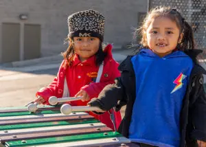2 school students playing on playground