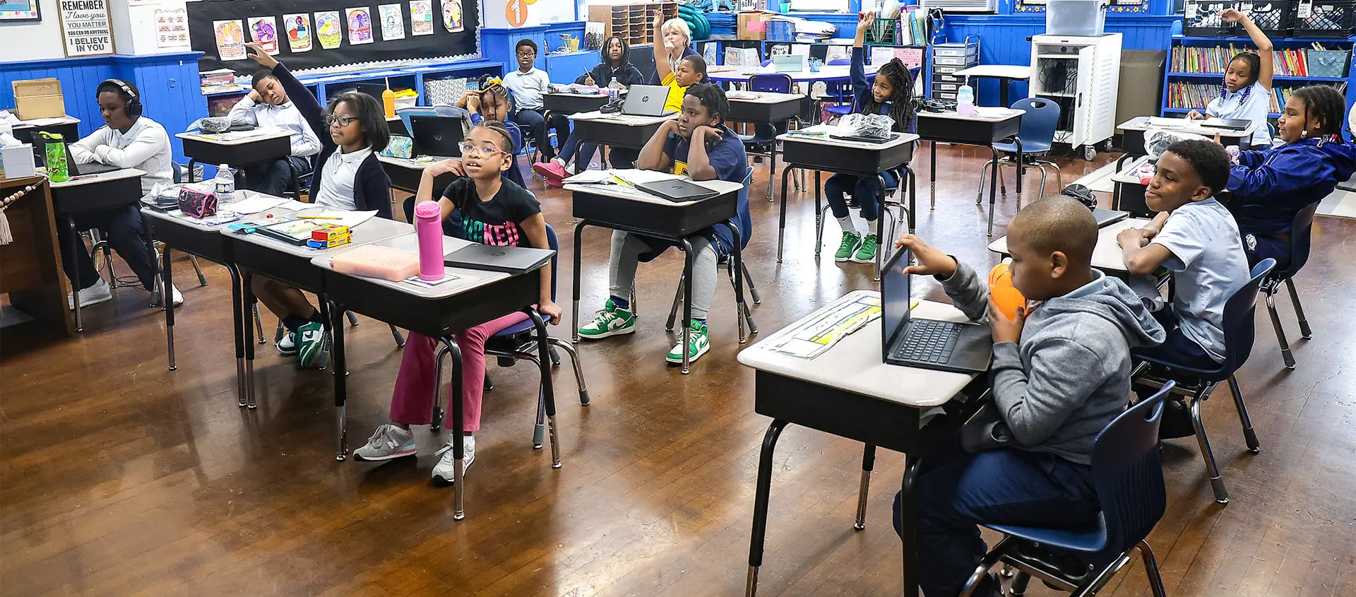Students at desks in a classroom