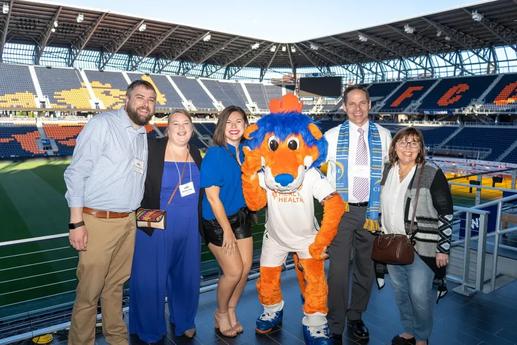 CISE Party at the Pitch group photo with mascot