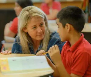 Principal talking with student