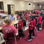 students making rosaries