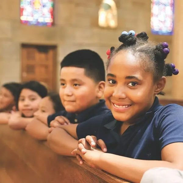 Children sitting on church pew