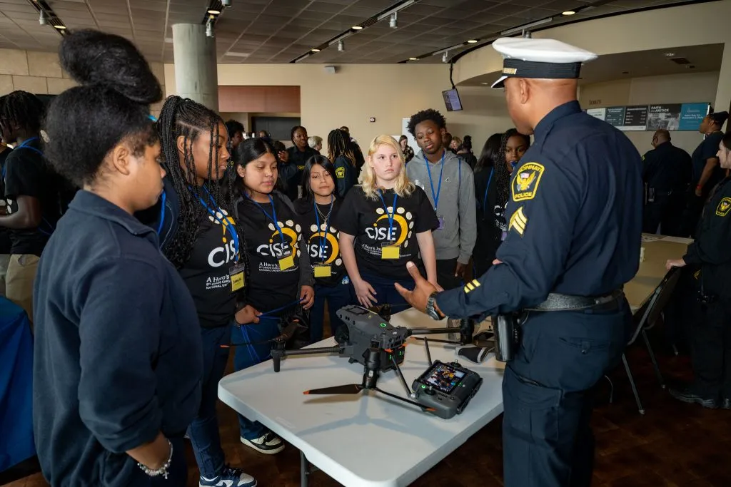 CISE Career Expo students speaking with police officer