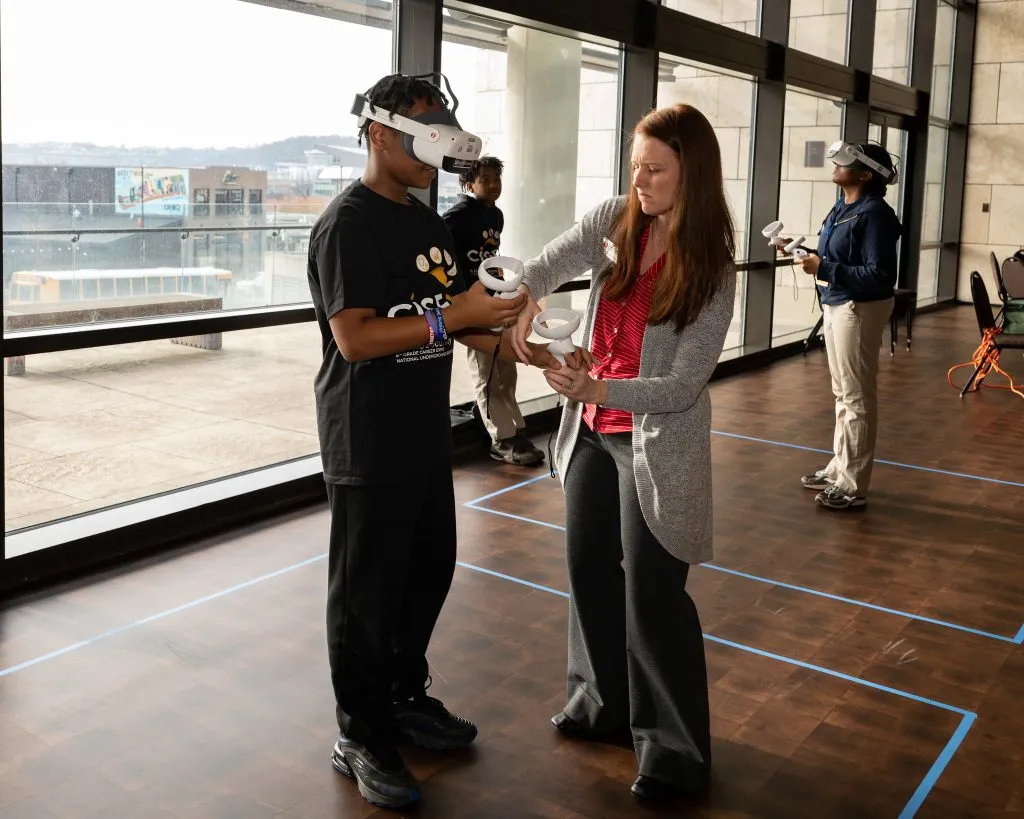 CISE Career Expo - male student using VR system