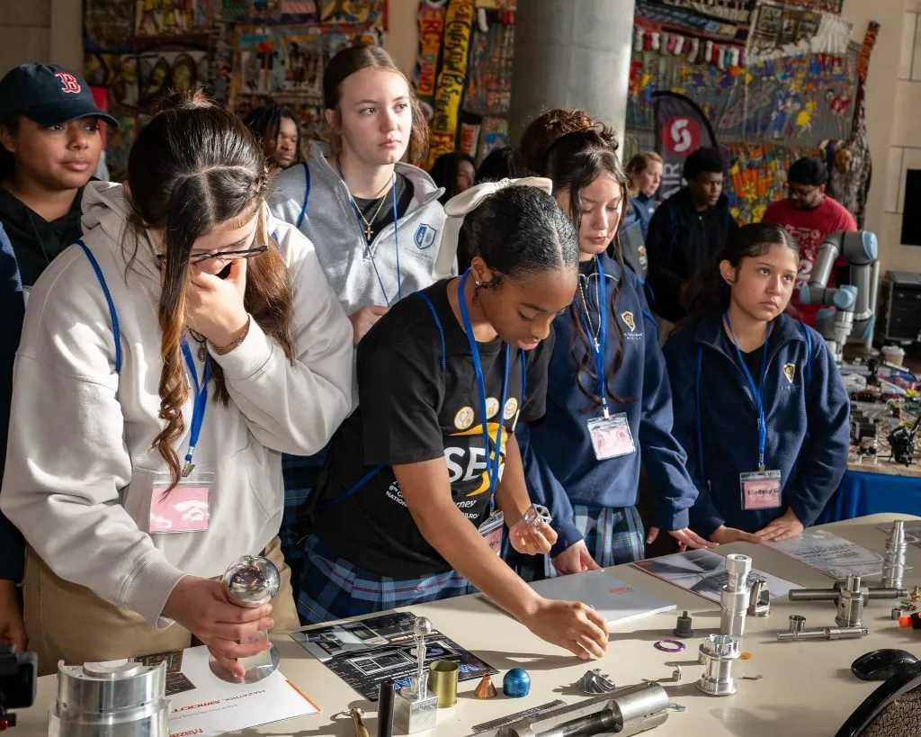 CISE Career Expo - students working with robotic components