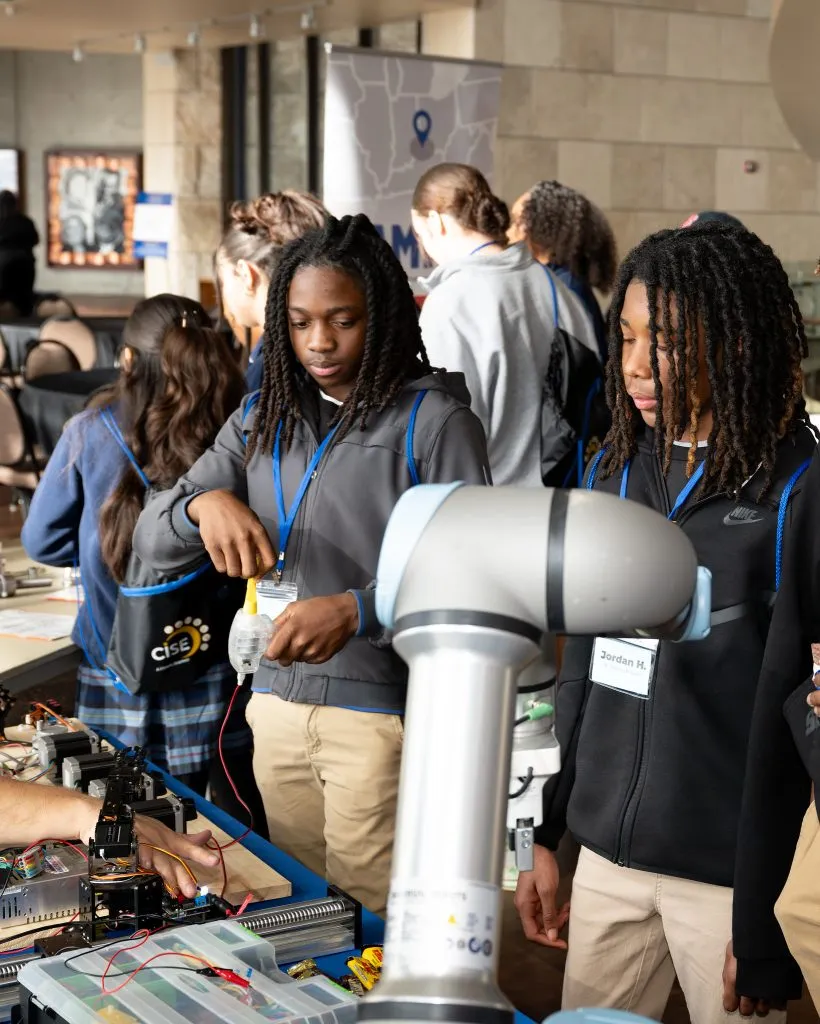CISE Career Expo - students working with robots
