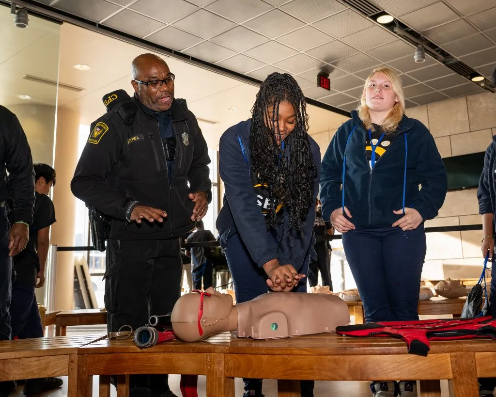CISE Career Expo - female student practicing CPR