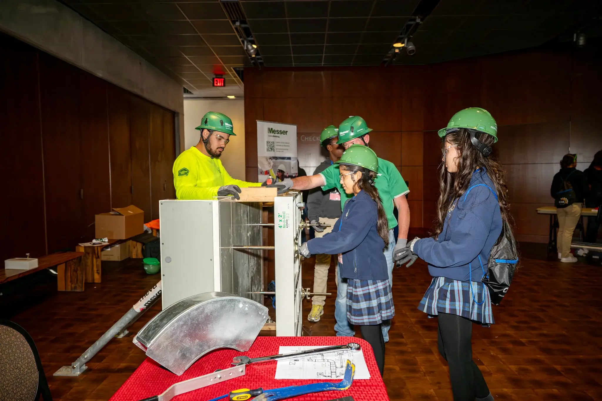 Group of student trying out tools for the construction industry